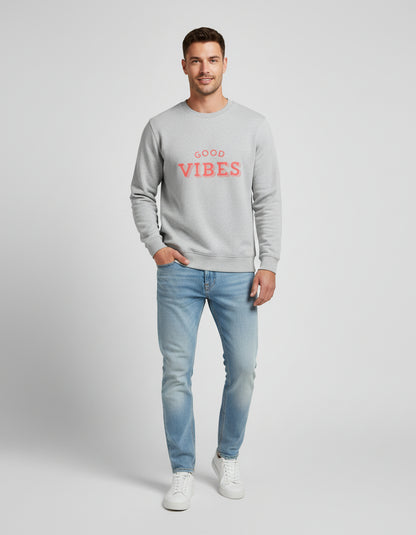 Gray sweatshirt with 'Good Vibes' text in red on a white background